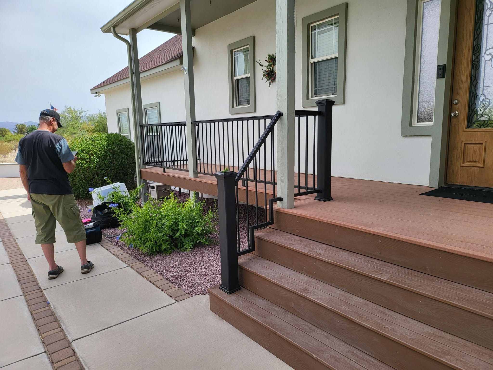 Black steel porch railing at a local property