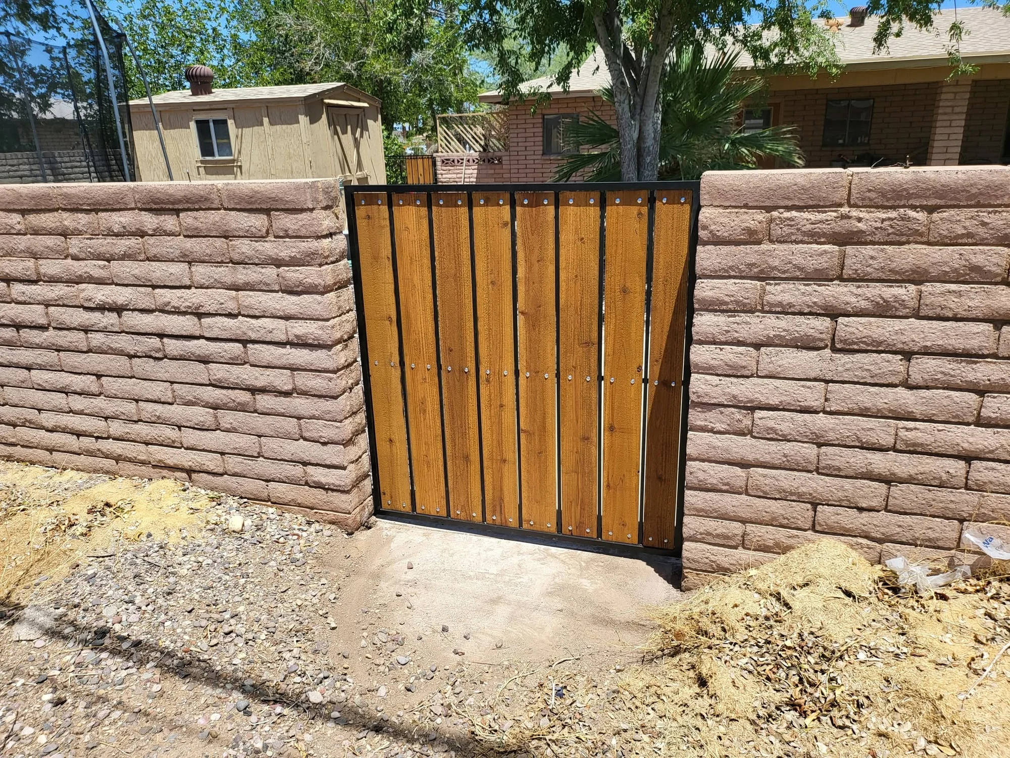 Steel walk gate with vertical wood infill