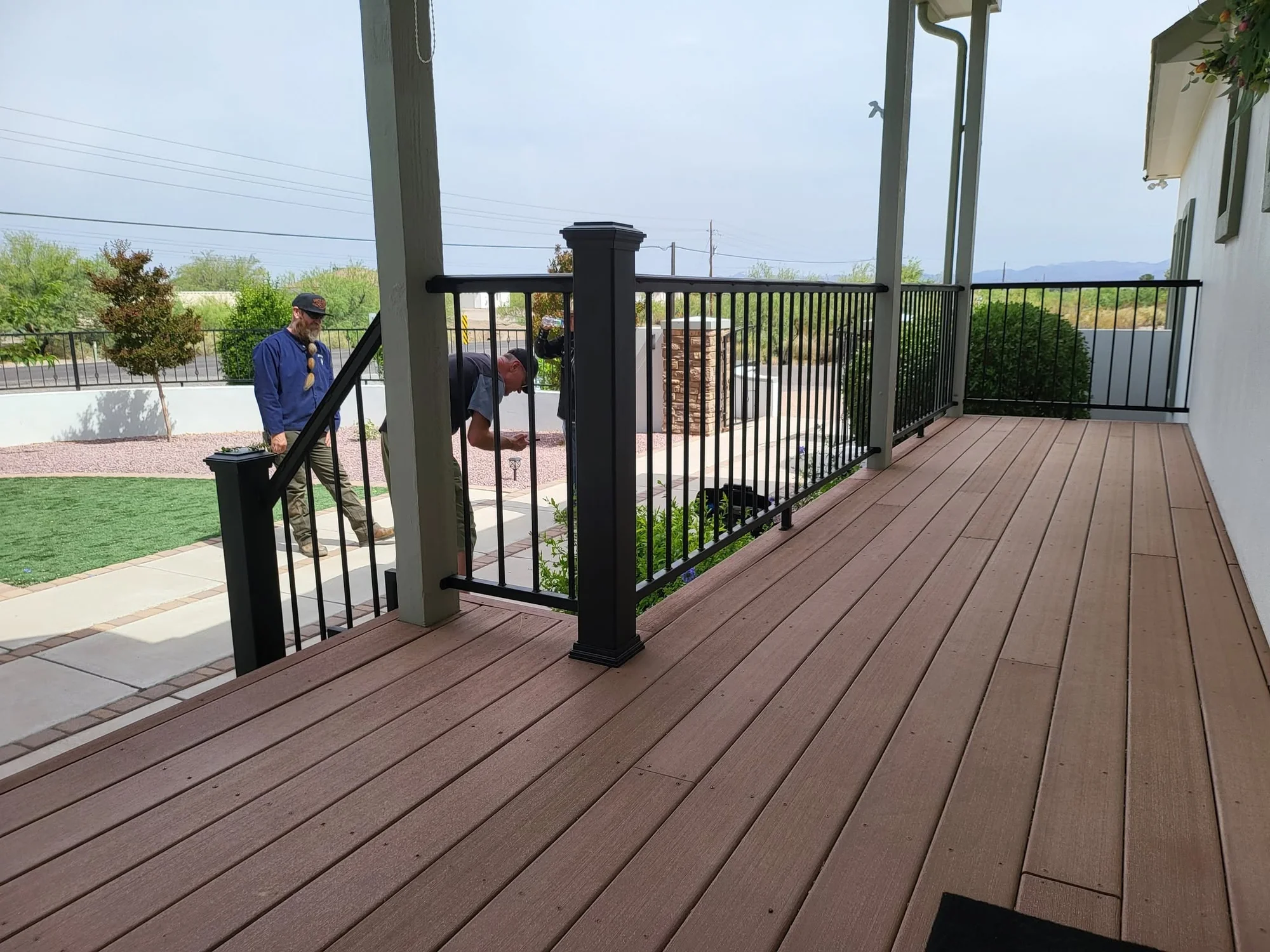 Steel porch railing viewed from the finished deck