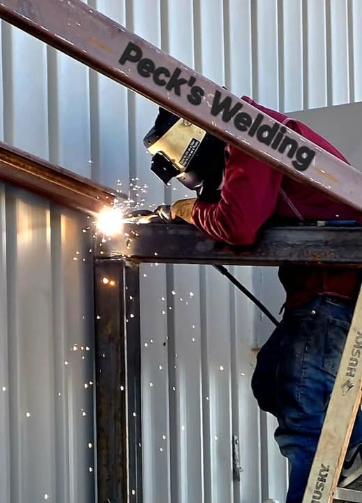 Peck's Welding fabricator welding a steel frame